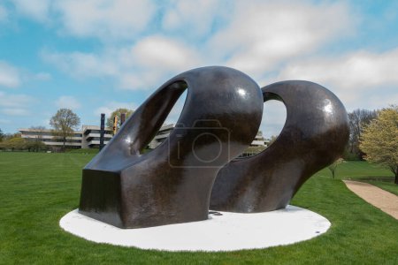 Photo for Purchase, NY  US  Apr 28, 2024 Henry Moores bronze abstract and monumental sculpture Double Oval installed on the Donald M Kendall Sculpture Gardens at the PepsiCo World headquarters in Purchase - Royalty Free Image