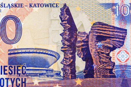 Foto de Monumento a los insurgentes silesianos y platillo en Katowice con dinero - Zloty polaco - Imagen libre de derechos