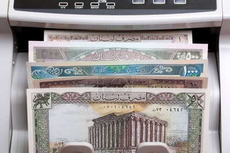 Old Yemeni money - rial in a counting machine