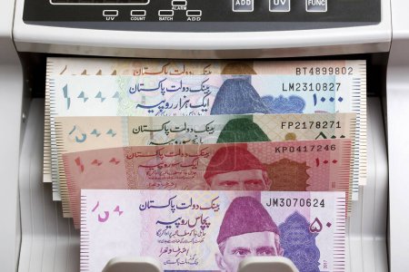 Pakistani money - rupee in a counting machine