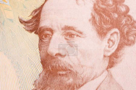 Foto de Charles Dickens un retrato de cerca del dinero inglés - Libra esterlina - Imagen libre de derechos