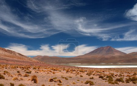 Photo for Vista of trails, wonderous landscapes, skies and mountains across the Altiplano in the high Andes of southwestern Bolivia - Royalty Free Image