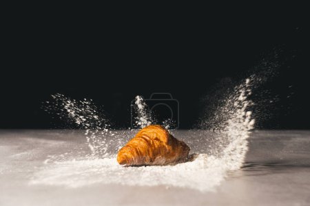 Photo for Splash with croissant in flour in a pastry shop - Royalty Free Image