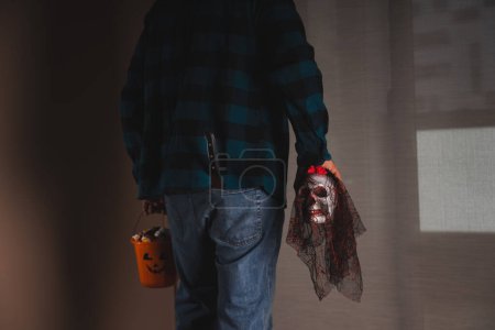 Photo for Halloween night skull knife and candy bucket - Royalty Free Image