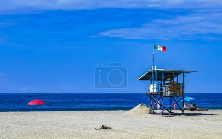 Photo for Sunshine parasol in the wind waves and beach sand in Zicatela Puerto Escondido Oaxaca Mexico. - Royalty Free Image