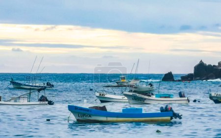 Photo for Puerto Escondido 18. October 2022 Boat yacht ship pier and harbor at the tropical mexican beach panorama view in Puerto Escondido zicatela Oaxaca Mexico. - Royalty Free Image