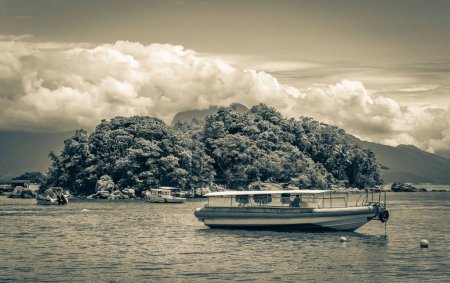 Photo for Old black and white picture of boat trip by Abraao beach and Ilhas do Macedo. Ilha Grande Angra dos Reis Rio de Janeiro Brazil. - Royalty Free Image