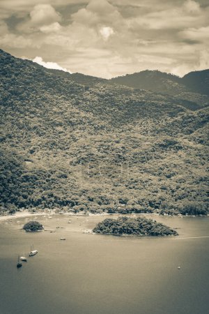 Photo for Old black and white picture of The big tropical island Ilha Grande Abraao beach panorama drone from above Angra dos Reis Rio de Janeiro Brazil. - Royalty Free Image