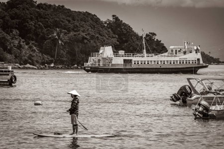Photo for Ilha Grande 23. November 2020 Old black and white picture of Boats ships and Boat trips from Abraao beach Ilha Grande Angra dos Reis Rio de Janeiro Brazil. - Royalty Free Image