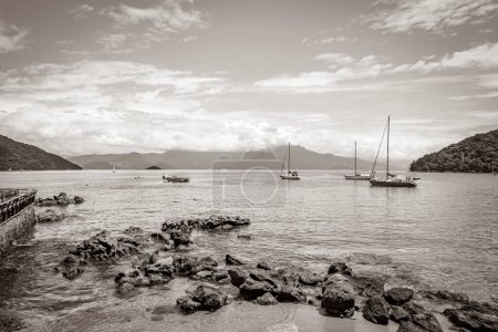 Photo for Old black and white picture of The big tropical island Ilha Grande Abraao beach in Angra dos Reis Rio de Janeiro Brazil. - Royalty Free Image
