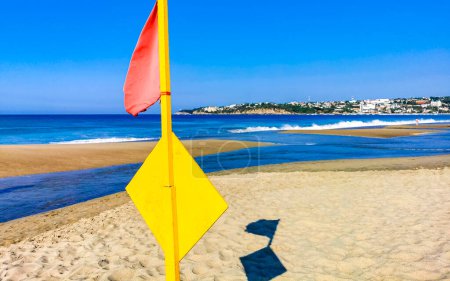 Photo for Red flag swimming prohibited high waves in Zicatela Puerto Escondido Mexico. - Royalty Free Image