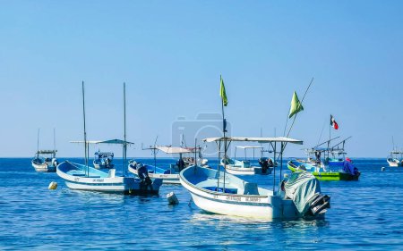 Photo for Puerto Escondido Oaxaca Mexico 16. December 2022 Fishing boats at the harbor and beach by Zicatela in Puerto Escondido Oaxaca Mexico. - Royalty Free Image