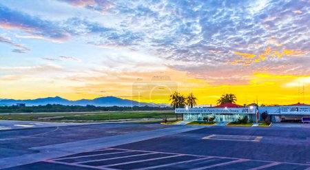 Photo for Colorful sunrise at airport with mountains in Zicatela Puerto Escondido Oaxaca Mexico. - Royalty Free Image