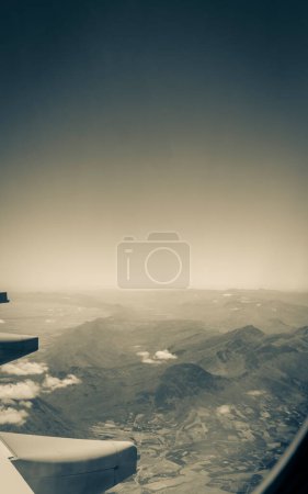 Photo for View from an airplane window at high altitude and turbines about South Africa. African Mountains. - Royalty Free Image