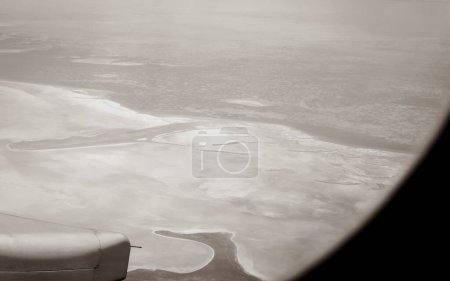Photo for View from an airplane window at high altitude and turbines about Africa. - Royalty Free Image