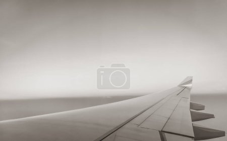 Photo for Sunrise view from an airplane window at high altitude about Africa. - Royalty Free Image