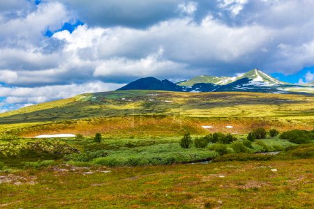 Beautiful mountain and landscape panorama with untouched nature rivers lakes and rocks stones in Rondane National Park Ringbu Innlandet Norway in Scandinavia.