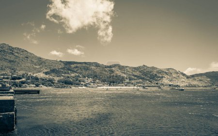 Foto de False Bay coast landscape with boulders beaches waves and mountains in Simons Town Cape Town Western Cape South Africa. - Imagen libre de derechos