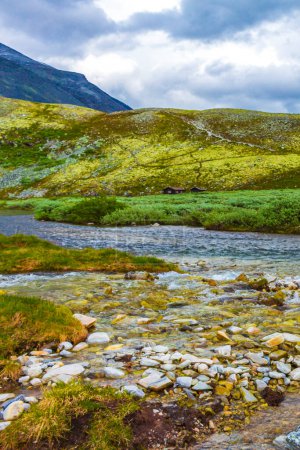 Photo for Beautiful mountain and landscape panorama with untouched nature rivers lakes and rocks stones in Rondane National Park Ringbu Innlandet Norway in Scandinavia. - Royalty Free Image