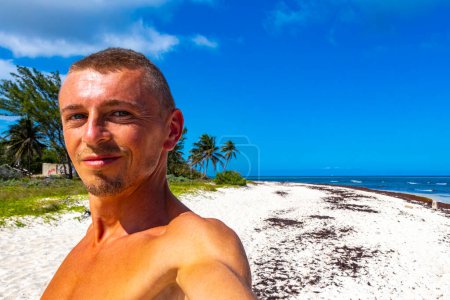Photo for Male tourist and traveler at tropical caribbean mexican beach in Playa del Carmen Quintana Roo Mexico. - Royalty Free Image