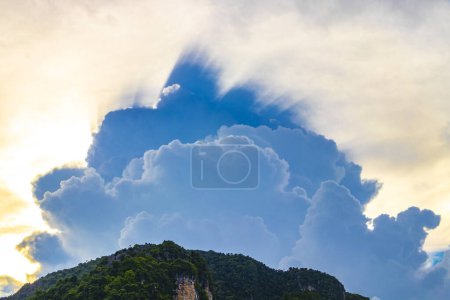Photo for Explosive mysterious clouds come out from behind limestone rocks on Koh Phi Phi Don island in Ao Nang Amphoe Mueang Krabi Thailand in Southeast Asia. - Royalty Free Image