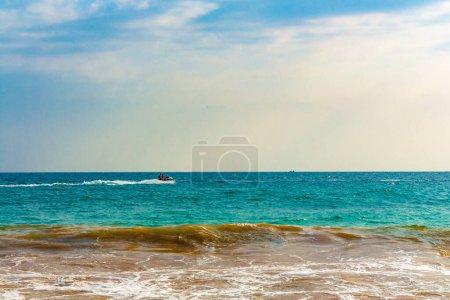 Photo for Beautiful paradise tropical beach with palm trees waves and sea water view in Mirissa Beach Southern Province Sri Lanka. - Royalty Free Image