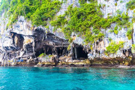 Photo for Limestone cave and turquoise blue water on the rock on Koh Phi Phi Don island in Ao Nang Amphoe Mueang Krabi Thailand in Southeast Asia. - Royalty Free Image