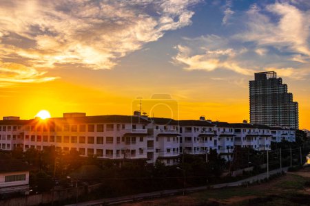 Beautiful golden colorful sunrise over the city panorama in Pattaya Bang Lamung Amphoe Chon Buri Thailand in Southeastasia Asia.