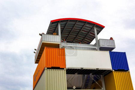 Photo for Bremerhaven Bremen Germany 1330. June 2011 Container observation tower stacked colorful containers in ueberseehafen overseas port Bremerhaven Bremen Germany. - Royalty Free Image
