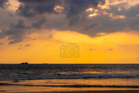 Beautiful colorful sunset and landscape panorama from Bentota Beach on Sri Lanka island.
