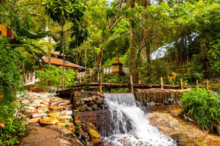 Beautiful waterfall on Doi Suthep Hiking Trail Wat Pha Lat in tropical jungle nature forest in Chiang Mai Amphoe Mueang Chiang Mai Thailand in Southeastasia Asia.