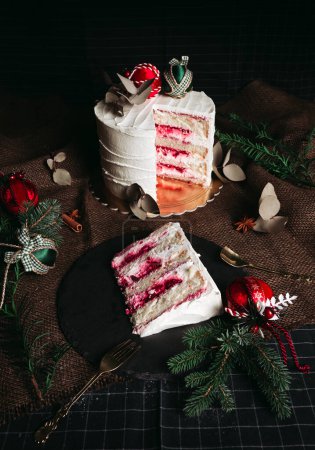 Photo for Beautiful white cake from baker on dark background. Slice of cake. Chocolate and strawberry cake. Dessert on christmas holidays. Delicious dessert - rustic and vintage style. - Royalty Free Image