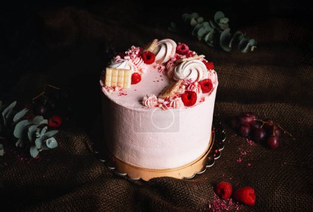 Photo for Pink birthday cream cake with fruits and chocolate on the top on dark background. Horizontal photo of beautiful cake - tart. - Royalty Free Image