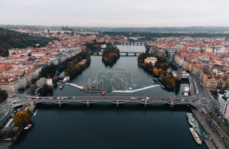 Photo for Aerial view of Prague city (Czech Republic) - famous bridges on Vltava river and old town in autumn time (Fall season). Prague from above, taken by drone - cityscape concept. - Royalty Free Image