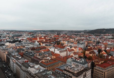 Photo for Beautiful aerial view of Prague city in Czech republic - historical part and old town in autumn time - taken by drone. Cityscape of Prague from above at evening - dark moody weather. - Royalty Free Image