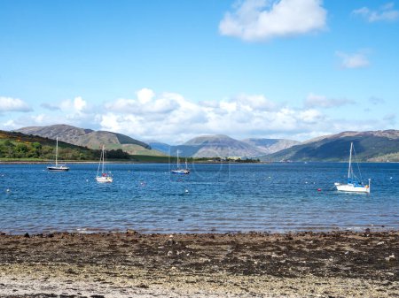 View of sailing boats and mountains from the coast at Port Bannatyne, Isle of Bute, Scotland