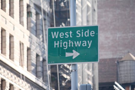 Photo for Green West Side Highway direction traffic sign in Manhattan - Royalty Free Image