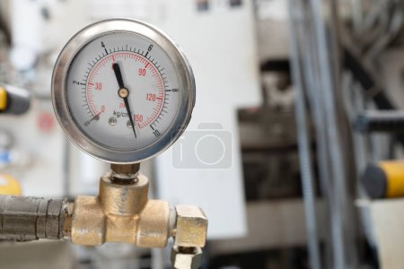 close up of pressure gauge on the machine , engineering equipment concept