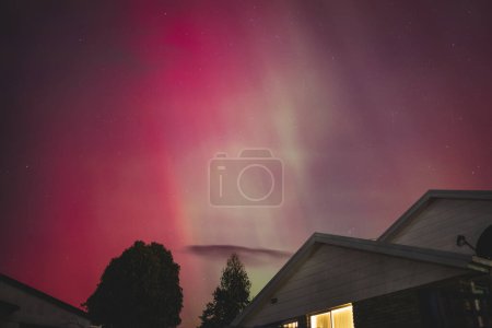 aurora australis or southern lights visible from Tasmania's clear night sky full of stars and constellations, shot in May 2024, geomagnetic storm event