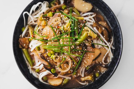 asian inspired rice noodle soup with green beans eggplant and water chestnuts, healthy vegan food recipes