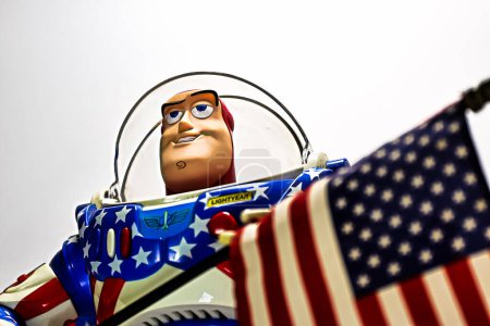Photo for Osaka,Japan - Apr 11, 2023 : Display of American Color Buzz Lightyear with USA Stars and Stripes Flag. - Royalty Free Image