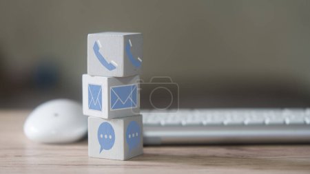 Photo for Customer support concept. Stack wood block with icons of contact methods, phone, email, address and chat message for design banner website. Concept of customer support, hotline and contact us - Royalty Free Image