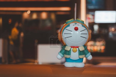 Photo for Samut Prakan, Thailand - October 8, 2023 : Plastic drink cup Doraemon to promote the movie of Doraemon The Movie 2023: Nobita's Sky Utopia. From SF Cinema city. SF Operates the cinema in Thailand. - Royalty Free Image