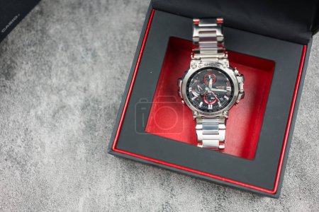 Photo for Bangkok, Thailand - January 25, 2024 : G-SHOCK watch model MTG-B1000D-1ADR model, an elegance and luxurious watch, stands out with a metallic red color. - Royalty Free Image