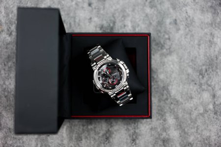 Photo for Bangkok, Thailand - February 3, 2024 : Open box of Casio G-Shock model MTG-B1000D-1ADR, stainless steel wristwatch. G-Shock is a line of watches manufactured by Casio. - Royalty Free Image