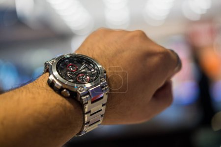 Photo for BANGKOK, THAILAND - FEBRUARY 5, 2024 : Casio G-Shock model MTG-B1000D-1ADR on man hand, stainless steel wristwatch. G-Shock is a line of watches manufactured by Casio. - Royalty Free Image