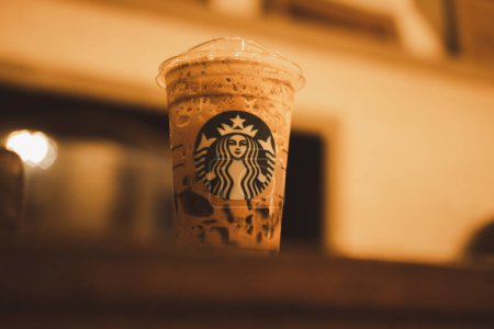 Photo for Bangkok, Thailand - February 9, 2024 : Starbuck Mocha frappuccino. Starbucks is the world's largest coffeehouse and is highly popular. - Royalty Free Image