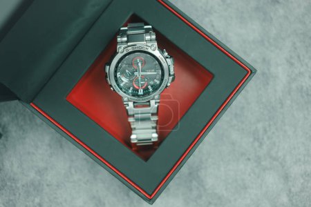 Photo for Bangkok, Thailand - February 12, 2024 : G-SHOCK watch model MTG-B1000D-1ADR model, an elegance and luxurious watch, stands out with a metallic red color. - Royalty Free Image