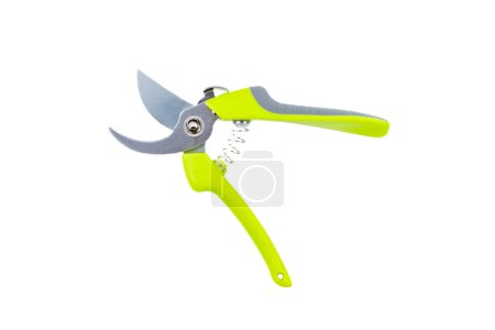 Steel gardening secateurs, scissors tool with green grip for pruning of plants and flowers, garden work, isolated on white background. Open state. Top view. Close-up.