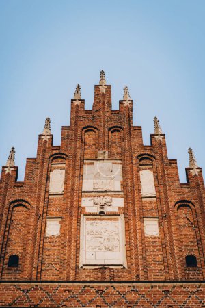 Corpus Christi Basilica red brick facade, Gothic church and landmark in Krakow, Poland